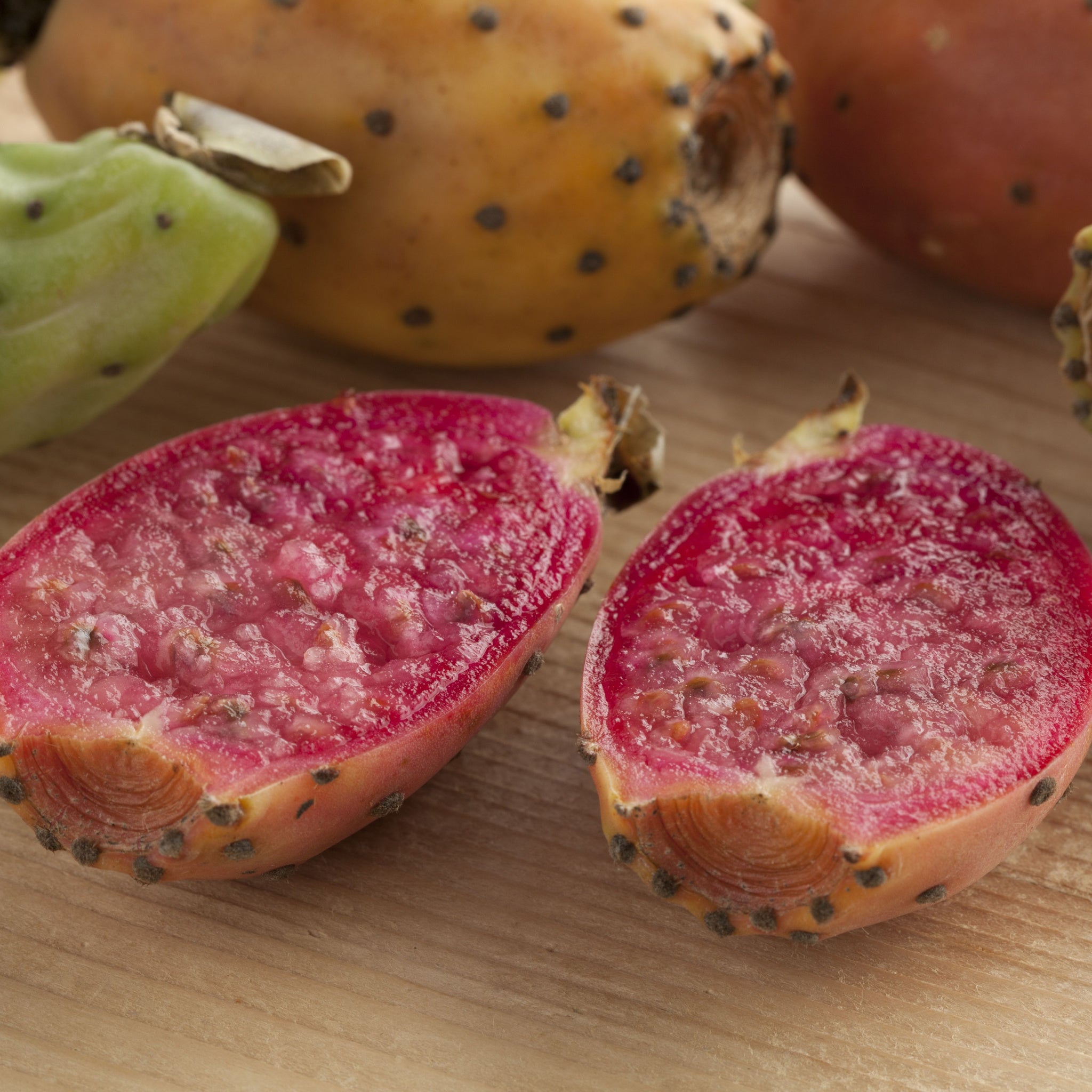 Fresh ripe whole and cut open prickly pear fruits.  Photo by Picture Partners