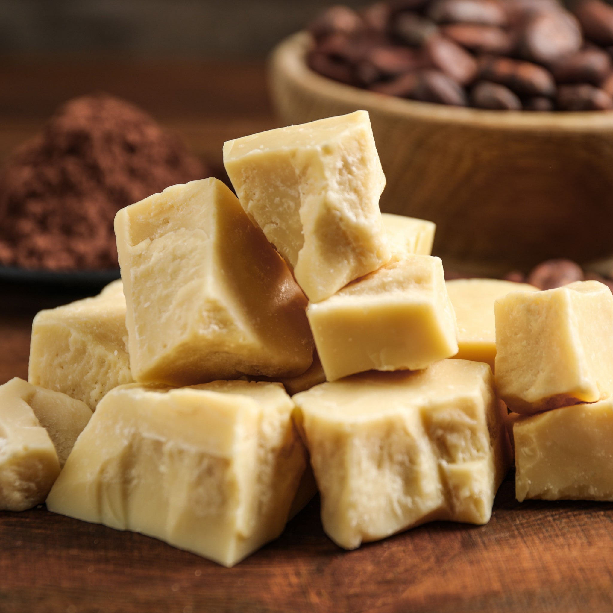 Wild Harvested Cacao (theobroma cacao) butter on wooden table, close up 